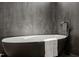 Luxurious freestanding bathtub with elegant black faucet, perfect for relaxation at 1616 Hunting Ridge Rd, Raleigh, NC 27615