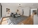 Large bedroom showcasing hardwood floors, accent rug, and lots of natural light at 1616 Hunting Ridge Rd, Raleigh, NC 27615