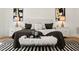 Tastefully decorated bedroom with black and white accents and a plush, comfortable bed at 1616 Hunting Ridge Rd, Raleigh, NC 27615