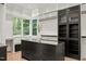 Well-organized walk-in closet with custom shelving, cabinetry, and a center island at 1616 Hunting Ridge Rd, Raleigh, NC 27615