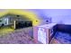 Modern entertainment room features a wet bar, plush carpet, and a large projector screen at 1616 Hunting Ridge Rd, Raleigh, NC 27615