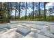 Cozy outdoor seating area with a modern fire pit, perfect for gathering and enjoying cool evenings at 1616 Hunting Ridge Rd, Raleigh, NC 27615