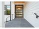 Modern front door entrance with clean lines, showcasing a stylish and welcoming entryway at 1616 Hunting Ridge Rd, Raleigh, NC 27615