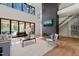 Living room with a modern fireplace, high ceilings, and lots of natural light at 1616 Hunting Ridge Rd, Raleigh, NC 27615