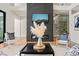 Bright living room with statement fireplace, modern furniture, and decor at 1616 Hunting Ridge Rd, Raleigh, NC 27615
