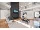 Cozy living room with fireplace, high ceilings, and staircase to the second floor at 1616 Hunting Ridge Rd, Raleigh, NC 27615