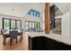 Open-concept living spaces with a kitchen island, dining table, and modern fireplace at 1616 Hunting Ridge Rd, Raleigh, NC 27615