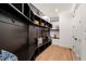 Mudroom with dark wood built-ins, bench seating, and storage cubbies at 1616 Hunting Ridge Rd, Raleigh, NC 27615