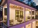 This home boasts a beautiful outdoor patio with ample seating, ceiling fans, and elegant glass railings for unobstructed views at 1616 Hunting Ridge Rd, Raleigh, NC 27615