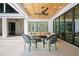 Spacious covered patio with comfortable seating, ceiling fans, and views of the backyard at 1616 Hunting Ridge Rd, Raleigh, NC 27615