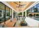 Expansive covered patio with outdoor seating, kitchen, and pool area for ultimate relaxation at 1616 Hunting Ridge Rd, Raleigh, NC 27615