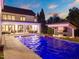 Beautiful pool, outdoor kitchen, and patio area offering the perfect space for relaxation and outdoor entertaining at 1616 Hunting Ridge Rd, Raleigh, NC 27615