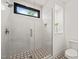Modern shower with glass door, white subway tile, stylish fixtures, a window and a built-in niche at 1616 Hunting Ridge Rd, Raleigh, NC 27615