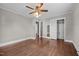 Bedroom with hardwood floor, closet with mirror, and hallway view at 1802 Prince Edward Dr, Elon, NC 27244