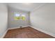 Bedroom featuring hardwood floors, neutral walls, and a bright window at 1802 Prince Edward Dr, Elon, NC 27244