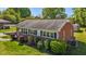 Charming brick ranch-style home with well-maintained landscaping and a covered entryway at 1802 Prince Edward Dr, Elon, NC 27244