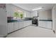 Bright kitchen features white cabinets, contrasting countertops, and stainless steel oven at 1802 Prince Edward Dr, Elon, NC 27244