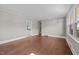 Spacious living room with hardwood floors, neutral paint, and natural light creating an airy feel at 1802 Prince Edward Dr, Elon, NC 27244