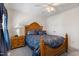 Bedroom featuring a decorative wooden headboard with blue bedding and soft gray carpet at 192 Ash Lily Ct, Nashville, NC 27856