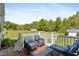 Outdoor deck featuring comfortable seating and a scenic view of the green backyard at 192 Ash Lily Ct, Nashville, NC 27856