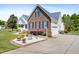 Charming two-story home featuring a landscaped yard, brick accents, and a side-entry two car garage at 192 Ash Lily Ct, Nashville, NC 27856