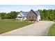 Charming brick and white home with a manicured lawn and a long driveway, perfect for suburban living at 192 Ash Lily Ct, Nashville, NC 27856