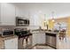 Well-lit kitchen features stainless steel appliances, granite countertops, and white cabinets at 192 Ash Lily Ct, Nashville, NC 27856