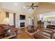 Open-concept living room featuring a fireplace, hardwood floors, and seamless connection to the kitchen at 192 Ash Lily Ct, Nashville, NC 27856