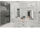 Modern bathroom featuring tiled shower, double vanity, and modern fixtures at 2019 James St, Durham, NC 27707