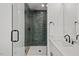 Contemporary bathroom with tiled shower, glass door and modern fixtures at 2019 James St, Durham, NC 27707