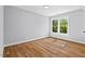 Empty bedroom with hardwood floors and lots of natural light at 2019 James St, Durham, NC 27707