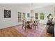 Bright dining room featuring a wood table, hardwood floors, and natural light at 2019 James St, Durham, NC 27707