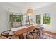 Open dining area with a wooden table, decorative centerpiece, and natural light at 2019 James St, Durham, NC 27707