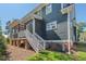 View of the home's exterior with a back porch and well-maintained landscaping at 2019 James St, Durham, NC 27707