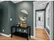 Decorated hallway leading to a bright bathroom with hardwood floors and a modern color scheme at 2019 James St, Durham, NC 27707