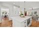 Open-concept kitchen with island flows into dining and living areas, great for entertaining at 2019 James St, Durham, NC 27707