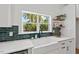 Bright kitchen features a farmhouse sink and stylish shelving at 2019 James St, Durham, NC 27707