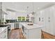 Well-lit kitchen offers stainless steel appliances, white countertops, and ample cabinet space at 2019 James St, Durham, NC 27707