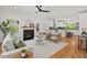 Inviting living room flows into a modern kitchen with hardwood floors and ample natural light at 2019 James St, Durham, NC 27707
