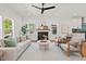Spacious living room with hardwood floors, fireplace, and open-concept design seamlessly connects to the kitchen at 2019 James St, Durham, NC 27707