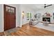 Bright living room with hardwood floors, fireplace, and a view of the front door creates an inviting space at 2019 James St, Durham, NC 27707