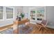 Charming home office with a wooden desk, decorative rug, and natural light at 2019 James St, Durham, NC 27707