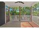 Relaxing screened-in porch featuring wood floors and a scenic view at 2019 James St, Durham, NC 27707