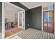 Charming screened porch with wood floors connecting to the dining room at 2019 James St, Durham, NC 27707