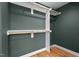 Spacious, well-lit walk-in closet with custom wood fixtures and shelving at 2019 James St, Durham, NC 27707