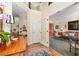 Welcoming foyer with hardwood floors, a vintage table, and an arched doorway to the living room at 205 Lippershey Ct, Cary, NC 27513