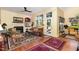 Comfortable living area with hardwood floors, a fireplace and bright windows with backyard views at 205 Lippershey Ct, Cary, NC 27513
