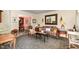 Cozy living room featuring decorative furniture, a decorative mirror, and an ornate area rug at 205 Lippershey Ct, Cary, NC 27513