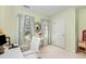 Stylish office space features a white desk, plush chair, and natural light at 205 Lippershey Ct, Cary, NC 27513