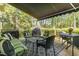 Covered patio space featuring comfortable outdoor seating and a shady awning at 205 Lippershey Ct, Cary, NC 27513